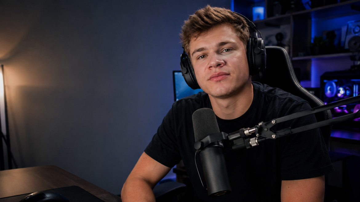 Jynxzi-inspired streamer portrait at a gaming setup with headphones, microphone, and creator studio lighting for “How Old Is Jynxzi?”